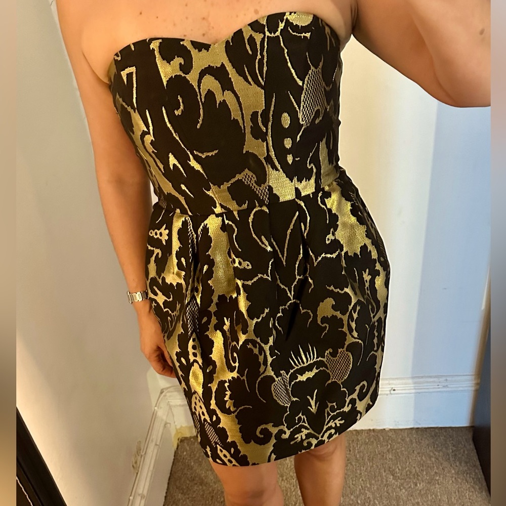 Black and gold bustier mini dress